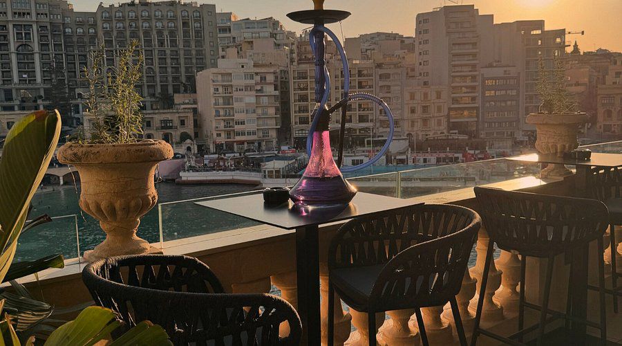 Hookah on the terrace at golden hour overlooking the bay