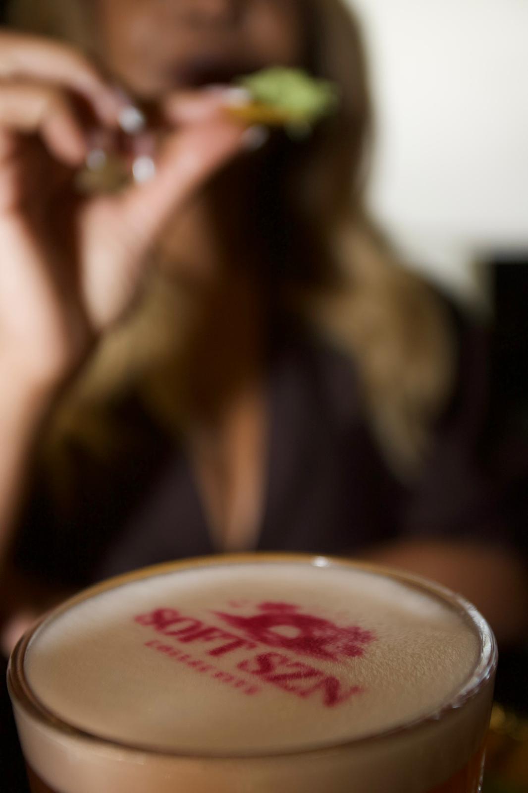 Guest holding a Soft Szn branded cocktail