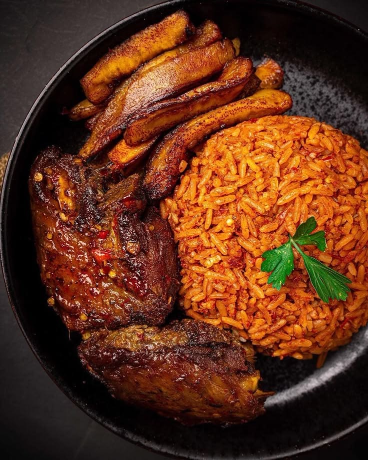 Jollof rice, plantain and grilled meat served at a Soft Szn brunch event