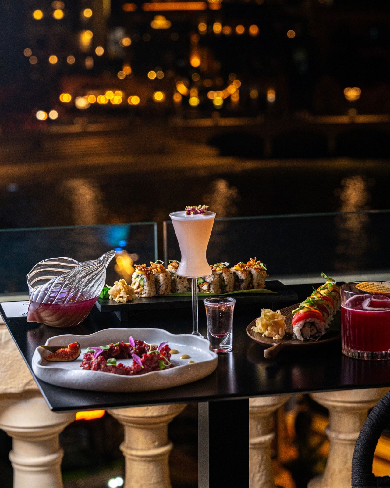 Sushi and cocktails spread at a Soft Szn brunch event